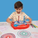 Boy using Spirograph Machine